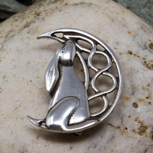 a pewter moon gazing hare brooch