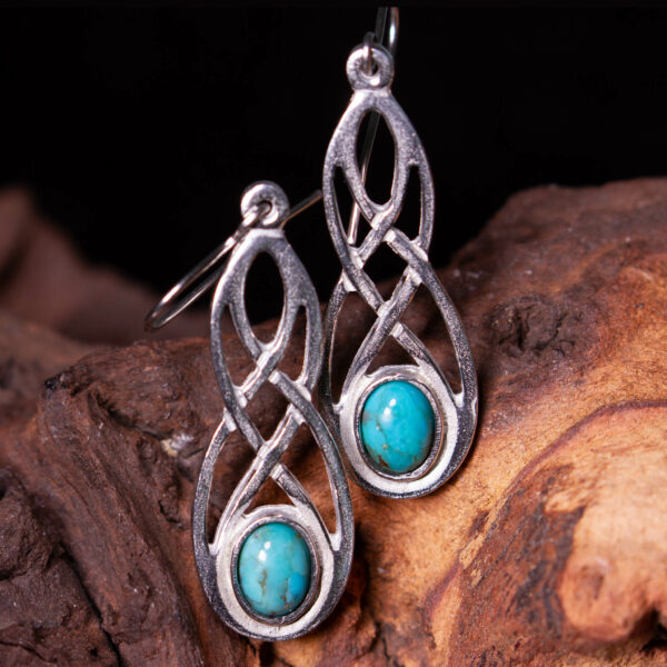 a pair of turquoise celtic earrings